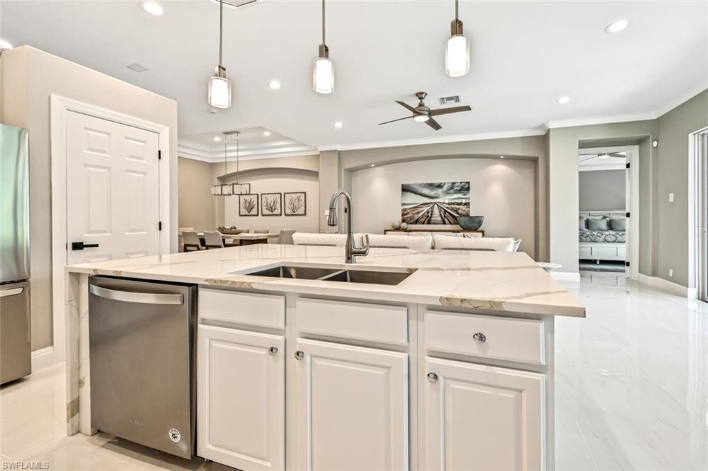 5616 Lago Villaggio Way Naples, FL 34104 - Photo 11 of 43 a bathroom with a sink and a mirror