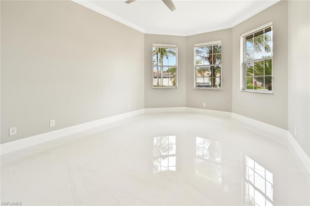 5616 Lago Villaggio Way Naples, FL 34104 - Photo 22 of 43 a view of empty room with window