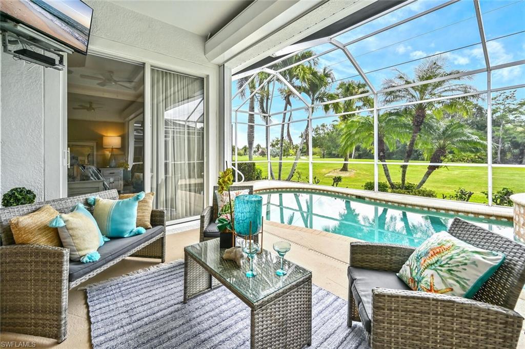 5616 Lago Villaggio Way Naples, FL 34104 - Photo 25 of 43 a living room with furniture and a window