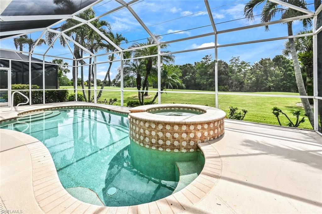 5616 Lago Villaggio Way Naples, FL 34104 - Photo 28 of 43 a view of a swimming pool with a patio