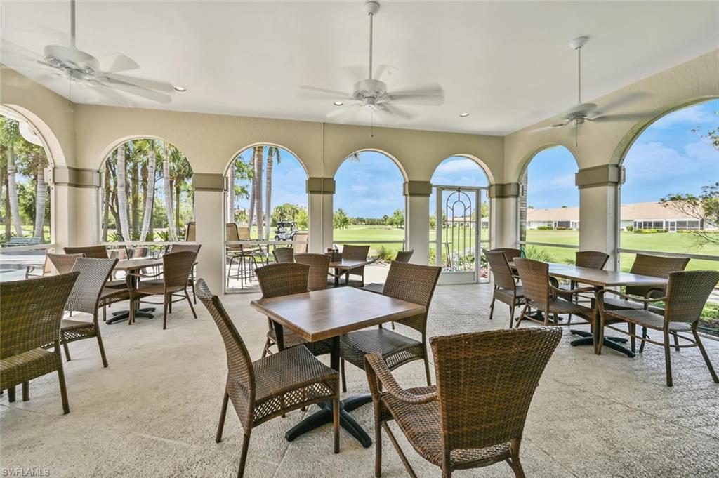 5616 Lago Villaggio Way Naples, FL 34104 - Photo 40 of 43 a view of a dining room with furniture window and outside view