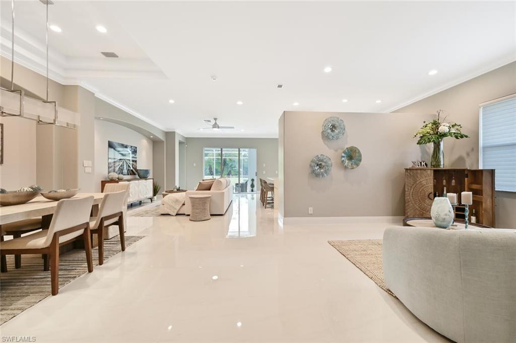 5616 Lago Villaggio Way Naples, FL 34104 - Photo 5 of 43 a living room with furniture