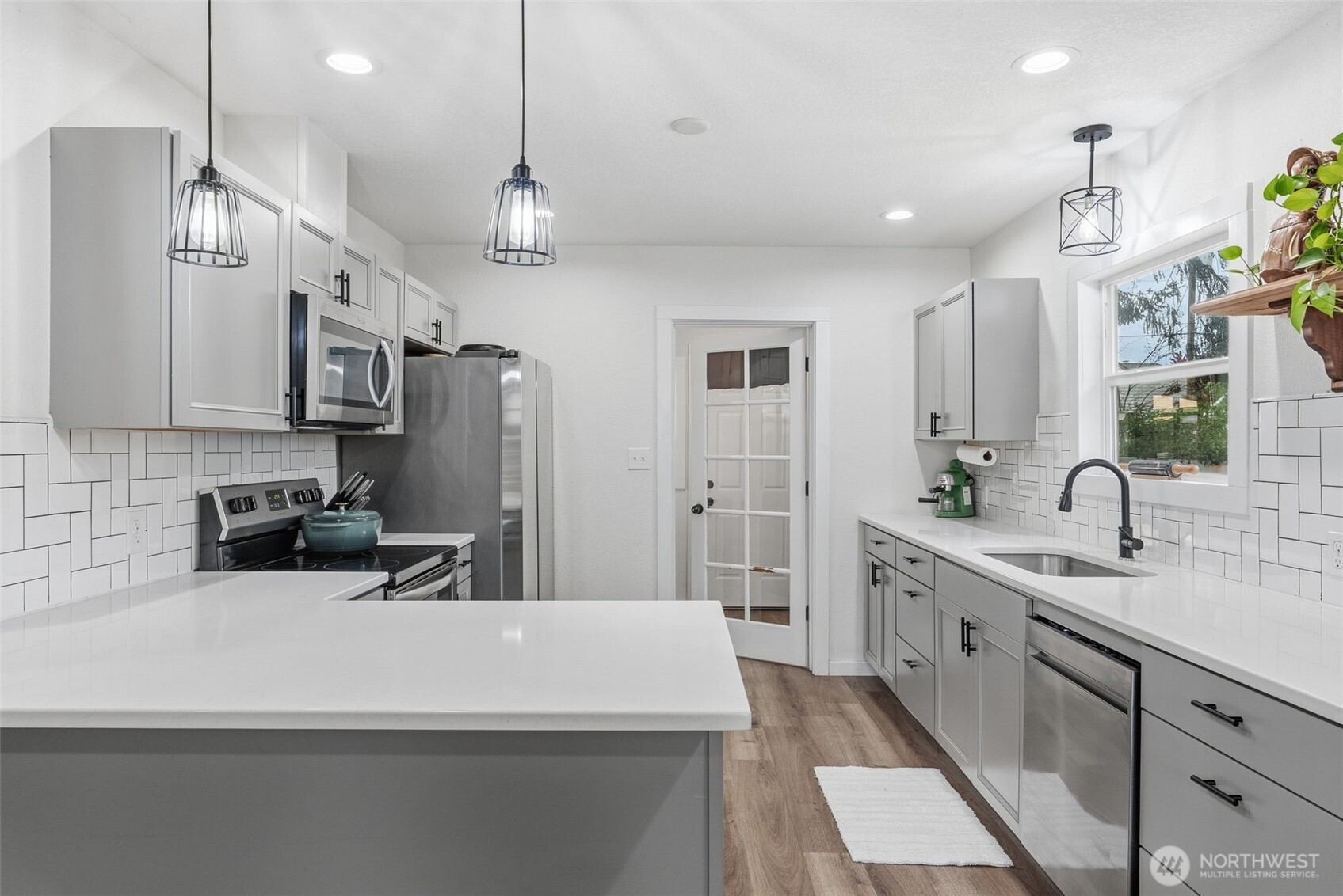 2828 Fir Street Longview, WA 98632 - Photo 7 of 18 a kitchen with stainless steel appliances a sink stove and refrigerator