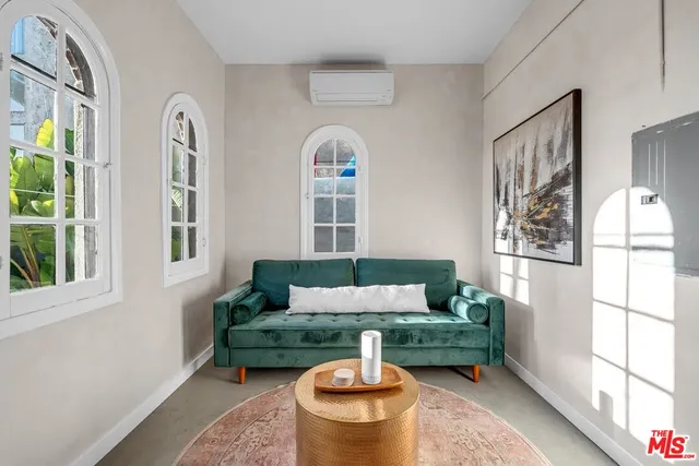 a view of livingroom with furniture and windows