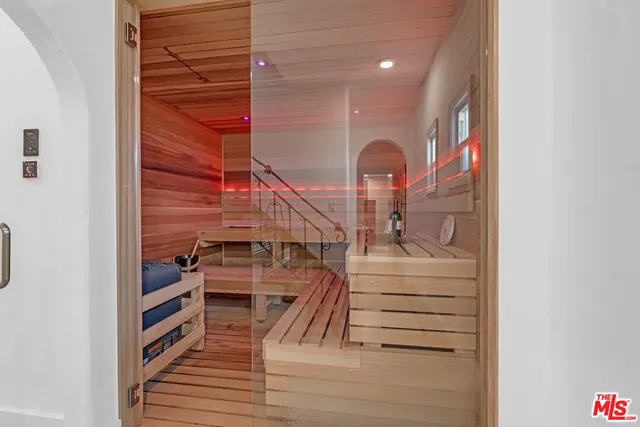 a bedroom with a bed and a potted plant