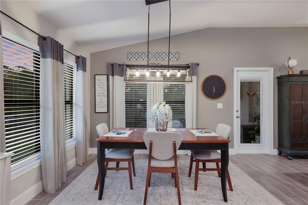 9318 46th Court East Parrish, FL 34219 - Photo 11 of 35 a view of a dining room with furniture window and outside view