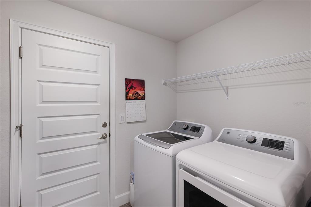 9318 46th Court East Parrish, FL 34219 - Photo 24 of 35 a utility room with dryer and washer