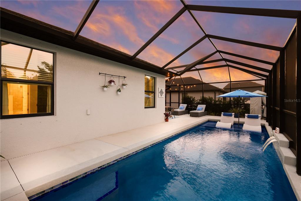 9318 46th Court East Parrish, FL 34219 - Photo 31 of 35 a view of swimming pool with sitting area
