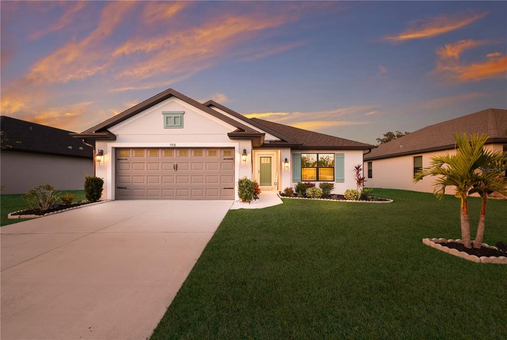 9318 46th Court East Parrish, FL 34219 - Photo 34 of 35 a front view of a house with garden