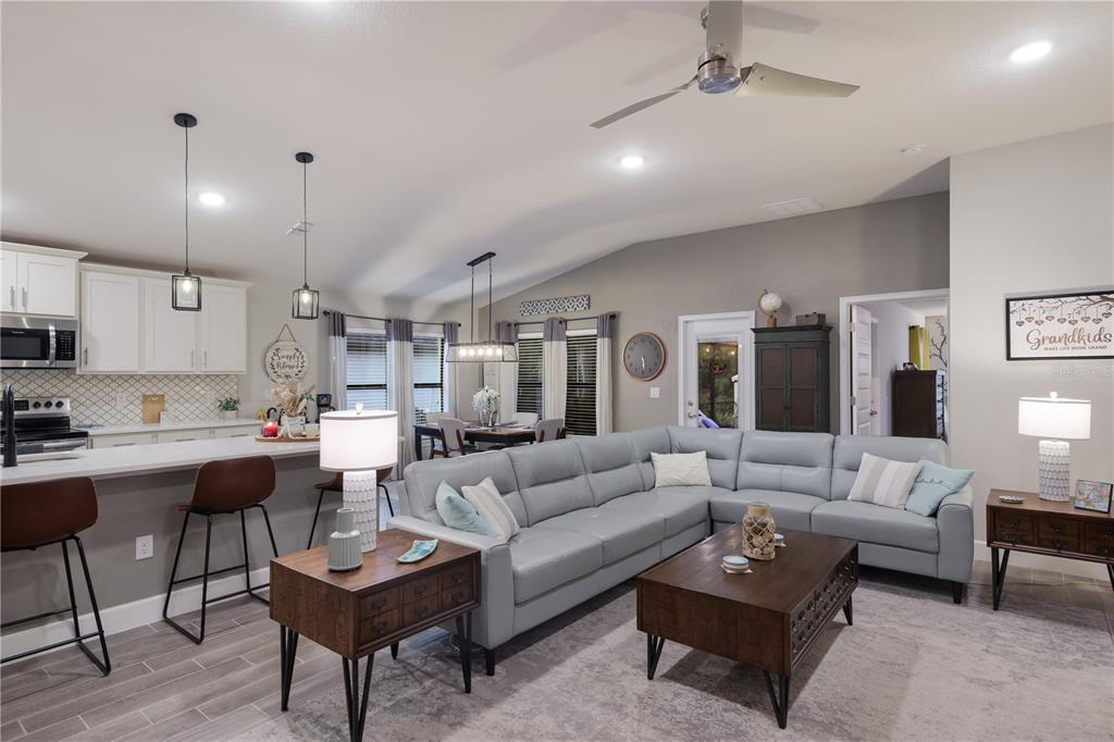 9318 46th Court East Parrish, FL 34219 - Photo 5 of 35 a living room with furniture kitchen view and a table
