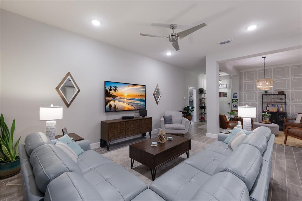 9318 46th Court East Parrish, FL 34219 - Photo 7 of 35 a living room with furniture and a flat screen tv