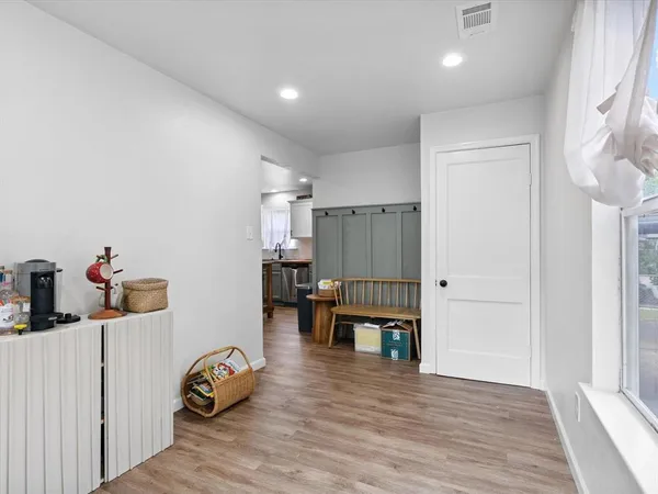 a bedroom with furniture and wooden floor