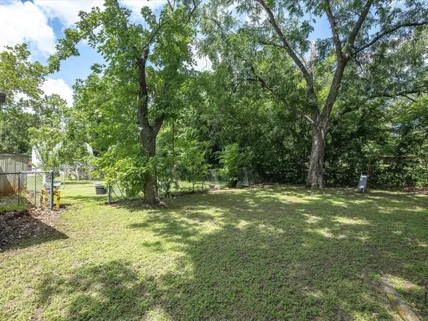 a view of a trees with a yard