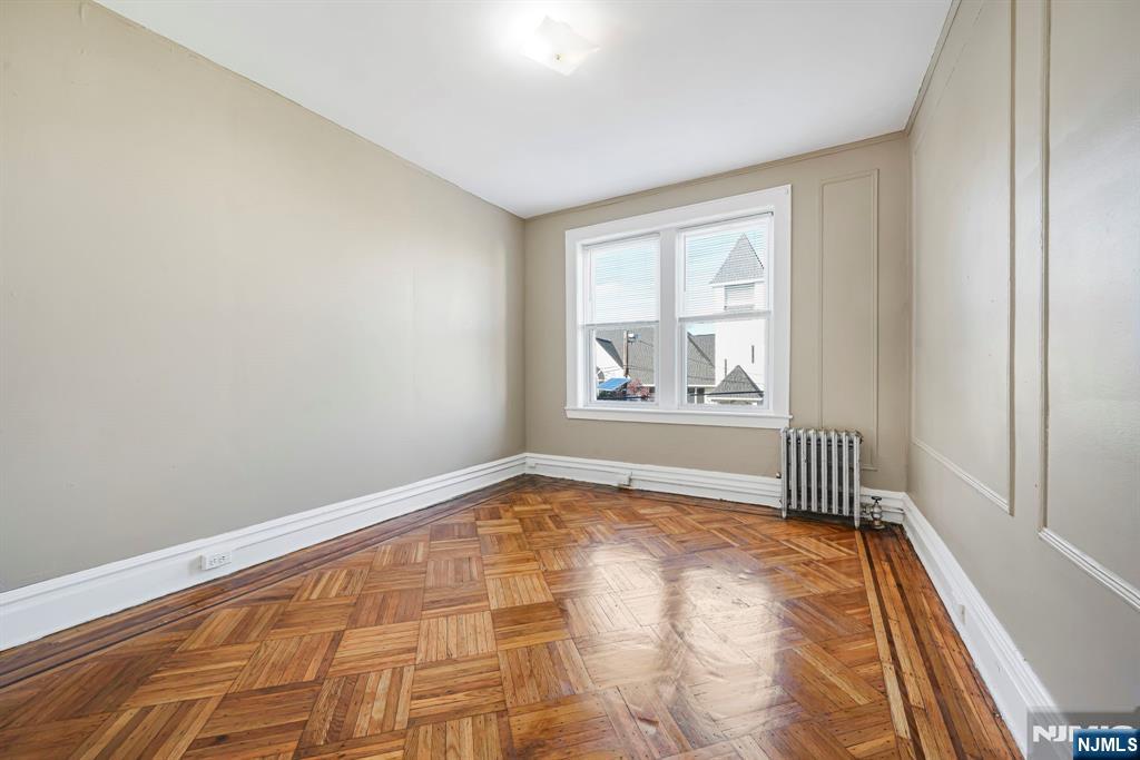 2 Washburn Place, Unit 202 Caldwell, NJ 07006 - Photo 13 of 16 a view of an empty room and window