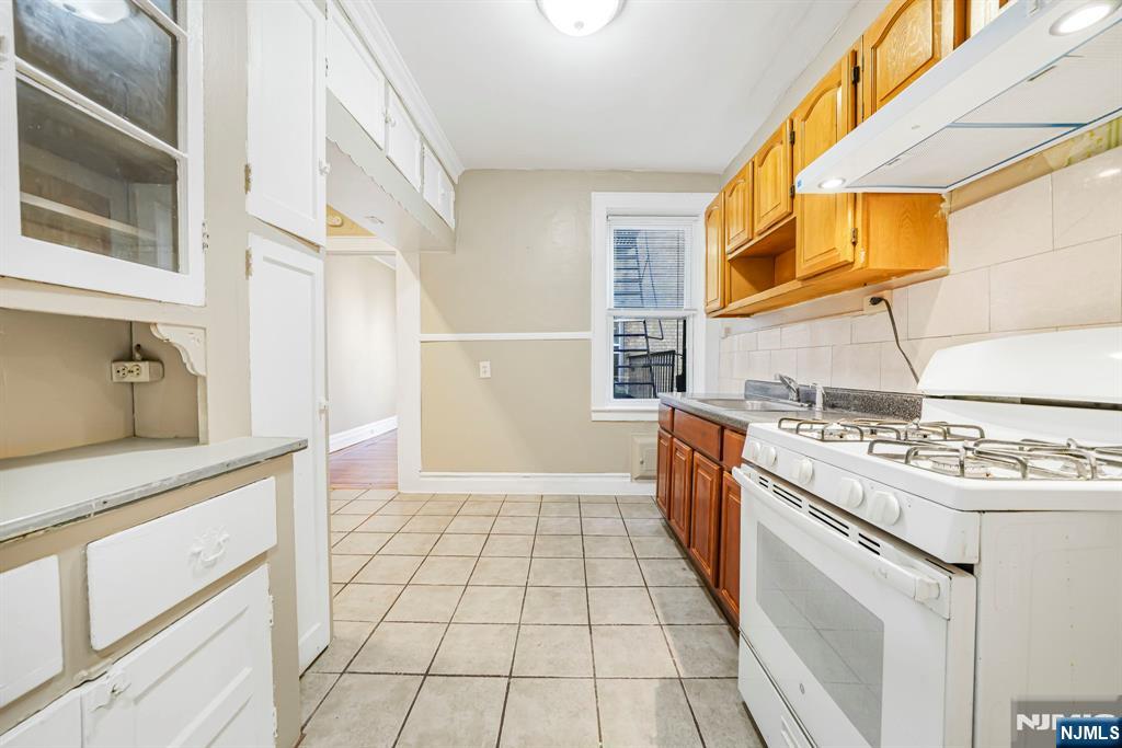2 Washburn Place, Unit 202 Caldwell, NJ 07006 - Photo 7 of 16 a kitchen with a sink and cabinets