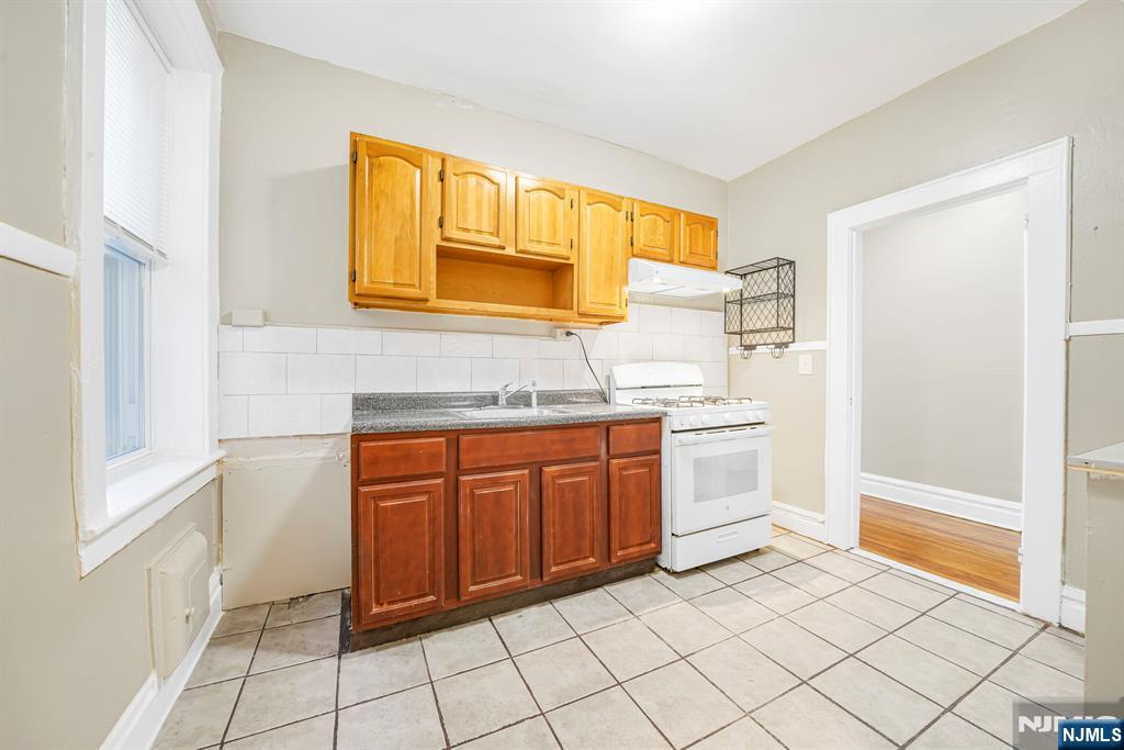 2 Washburn Place, Unit 202 Caldwell, NJ 07006 - Photo 8 of 16 a spacious bathroom with a mirror sink and cabinets