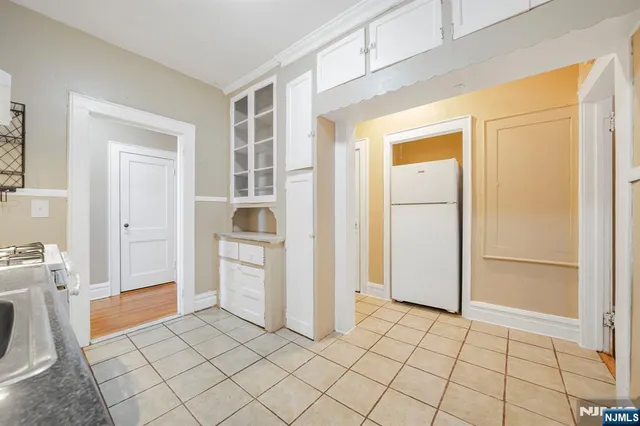 a view of a storage & utility room and a sink