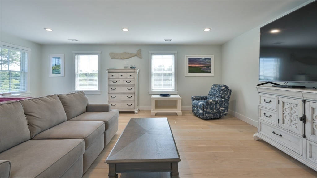 11 Miller Lane Nantucket, MA 02554 - Photo 12 of 21 a living room with furniture and a flat screen tv