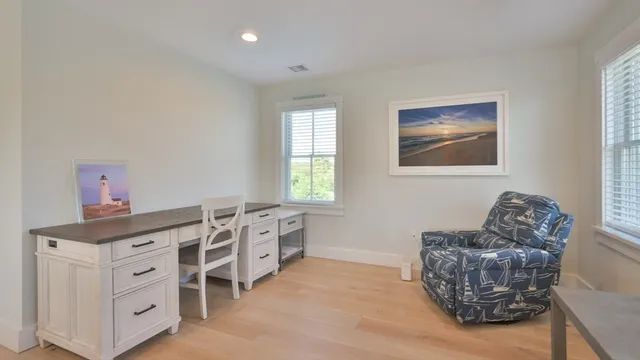 a bedroom with furniture and windows