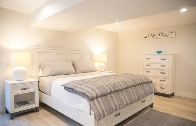 a bedroom with a bed and a dresser