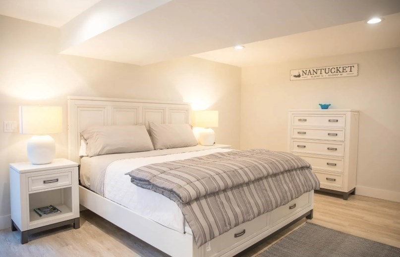 11 Miller Lane Nantucket, MA 02554 - Photo 15 of 21 a bedroom with a bed and a dresser
