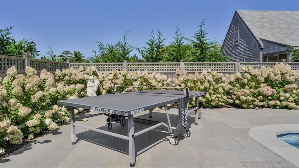 11 Miller Lane Nantucket, MA 02554 - Photo 20 of 21 a view of a chairs and table on the terrace