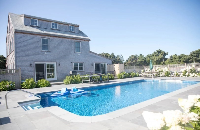 11 Miller Lane Nantucket, MA 02554 - Photo 21 of 21 a view of a house with pool and a chairs