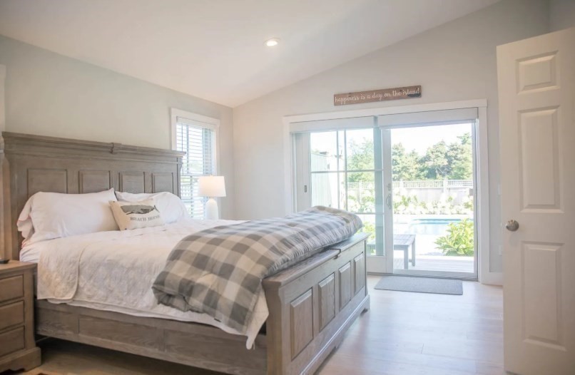11 Miller Lane Nantucket, MA 02554 - Photo 10 of 21 a bedroom with a bed next to a window