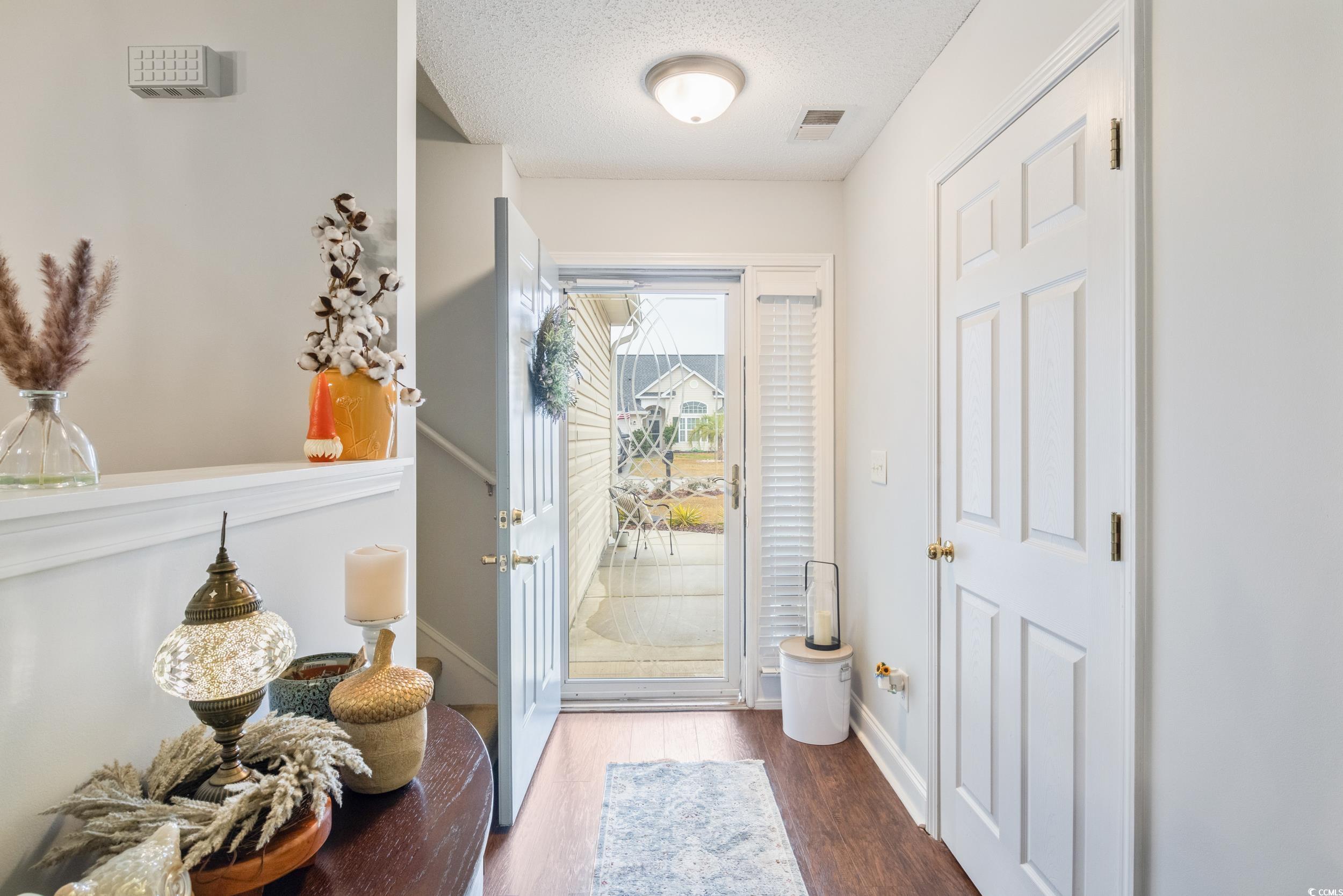 109 Dry Valley Loop Myrtle Beach, SC 29588 - Photo 8 of 40 Entryway featuring a textured ceiling and dark har