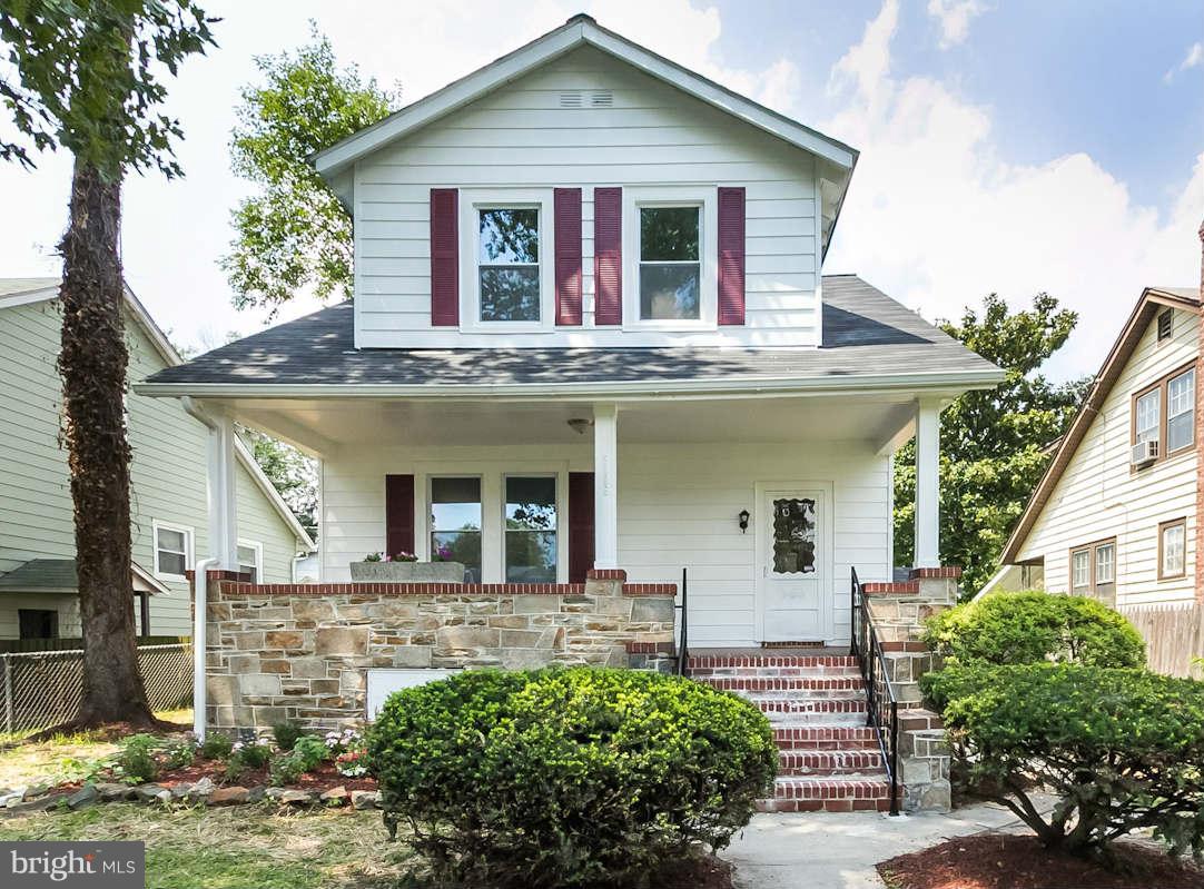 5006 Levindale Road Baltimore, MD 21215 - Photo 1 of 23 a front view of a house with garden