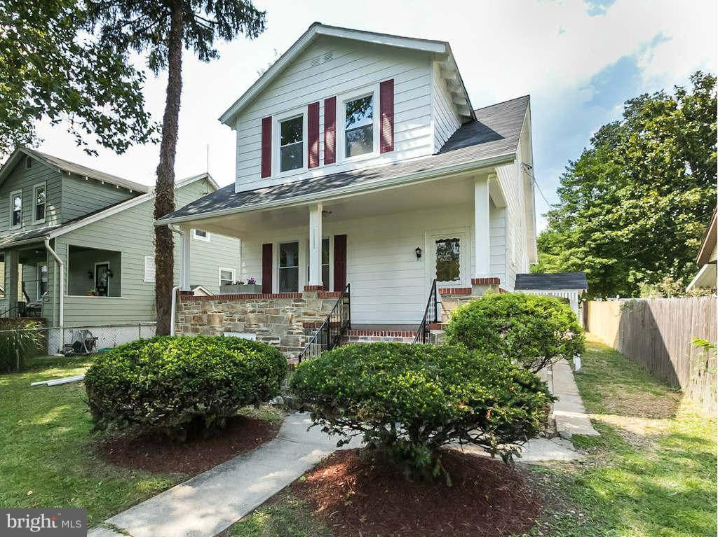 5006 Levindale Road Baltimore, MD 21215 - Photo 3 of 23 front view of a house with a yard