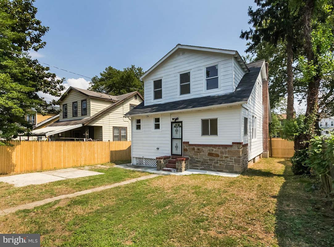5006 Levindale Road Baltimore, MD 21215 - Photo 23 of 23 a front view of a house with a yard