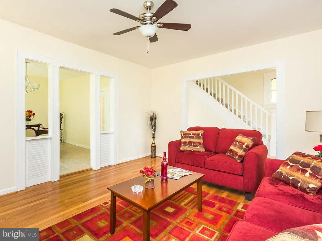 5006 Levindale Road Baltimore, MD 21215 - Photo 7 of 23 a living room with furniture and a wooden floor