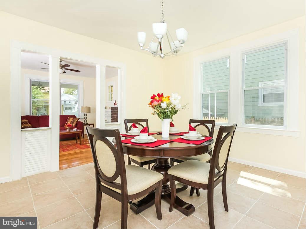 5006 Levindale Road Baltimore, MD 21215 - Photo 10 of 23 a view of a dining room with furniture and a chandelier