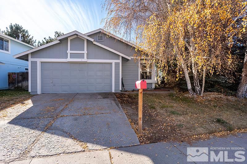 6082 Bankside Way Reno, NV 89523 - Photo 1 of 17 a front view of house with yard