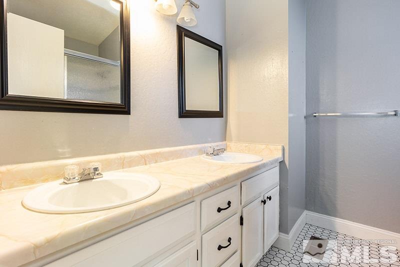 6082 Bankside Way Reno, NV 89523 - Photo 11 of 17 a bathroom with a sink and a mirror