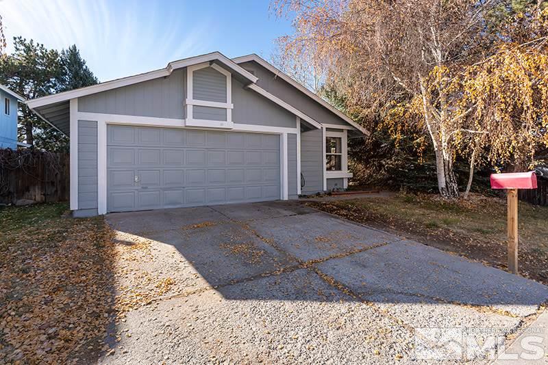 6082 Bankside Way Reno, NV 89523 - Photo 2 of 17 a front view of house with yard
