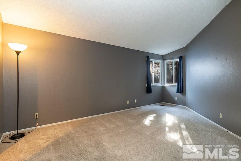 6082 Bankside Way Reno, NV 89523 - Photo 10 of 17 a view of an empty room with windows
