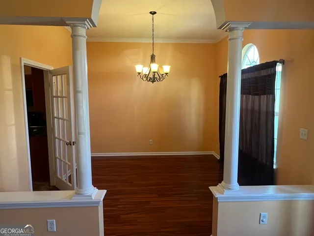 a view of a hallway with front door