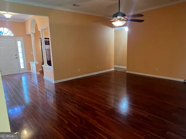 a view of a livingroom with wooden floor