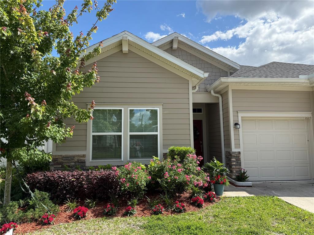 7656 Southwest 74th Loop Ocala, FL 34474 - Photo 2 of 95 front view of a house with a yard