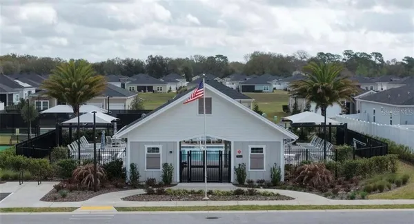 a view of a house with swimming pool