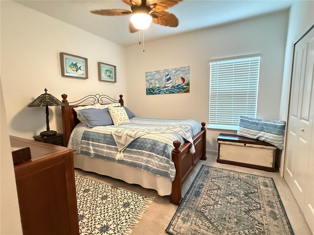 7656 Southwest 74th Loop Ocala, FL 34474 - Photo 53 of 95 a bedroom with a bed and wooden floor