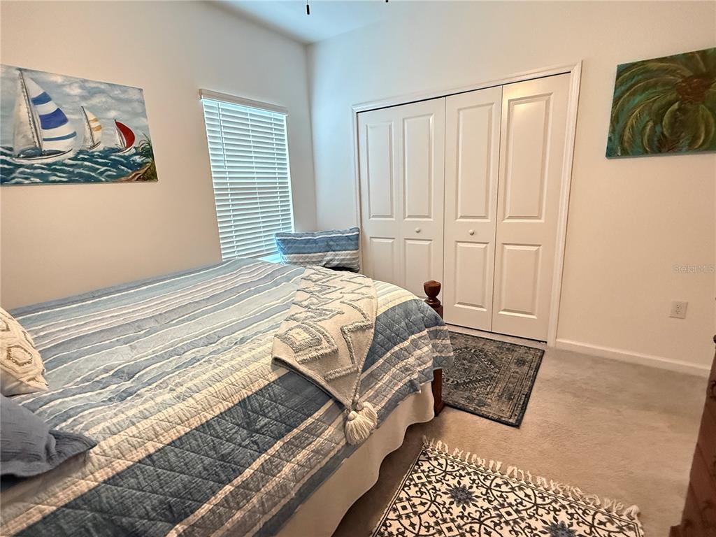 7656 Southwest 74th Loop Ocala, FL 34474 - Photo 55 of 95 a bedroom with a bed and a window