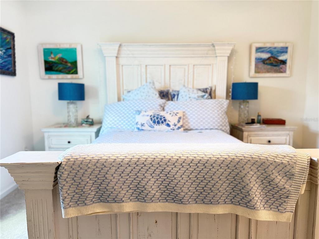 7656 Southwest 74th Loop Ocala, FL 34474 - Photo 62 of 95 a bedroom with a bed and a couch