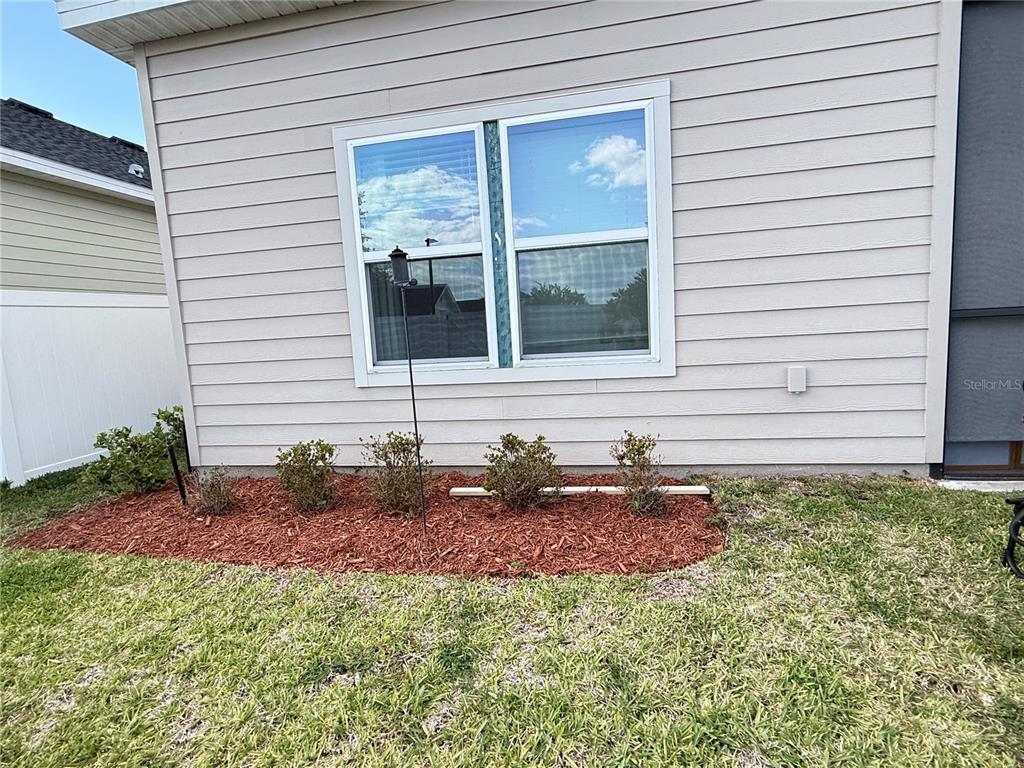 7656 Southwest 74th Loop Ocala, FL 34474 - Photo 86 of 95 a front view of a house with a yard