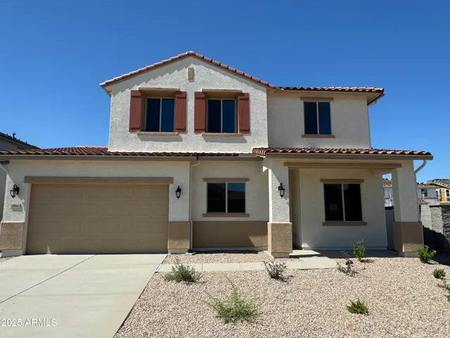 a front view of a house with yard