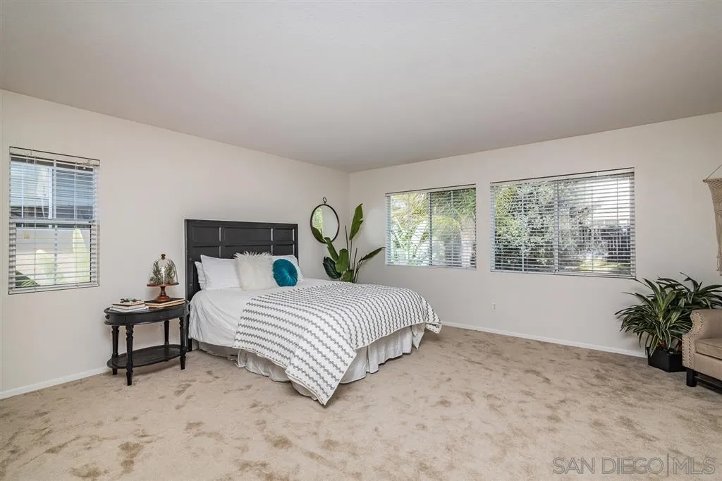 1088 Greenway Road Oceanside, CA 92057 - Photo 11 of 25 a bedroom with a bed and a window