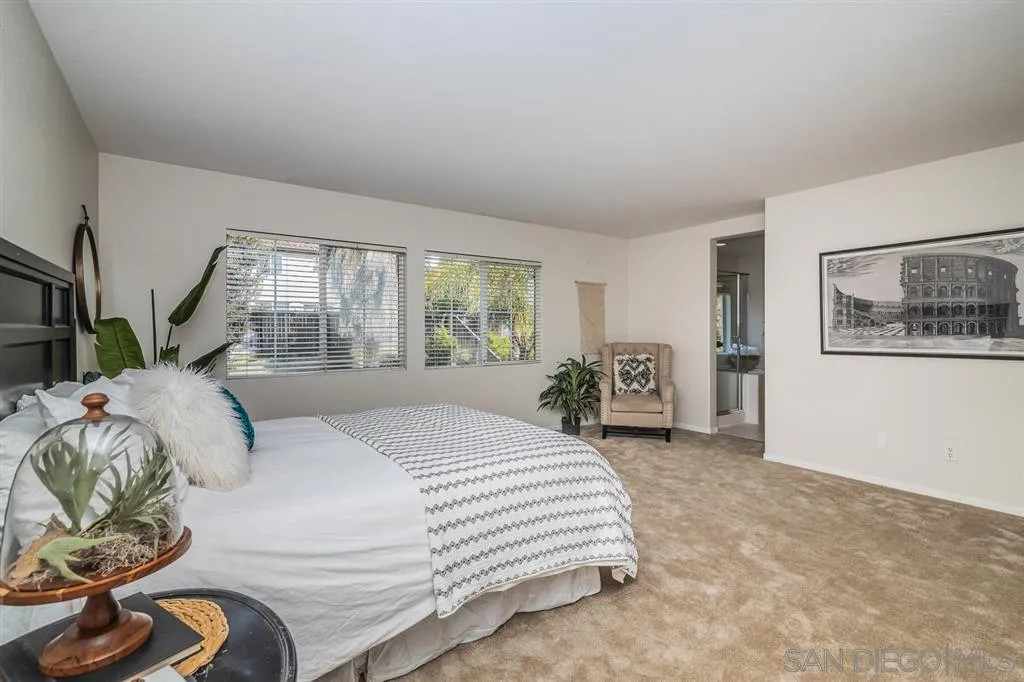 1088 Greenway Road Oceanside, CA 92057 - Photo 12 of 25 a bedroom with a bed and a large window