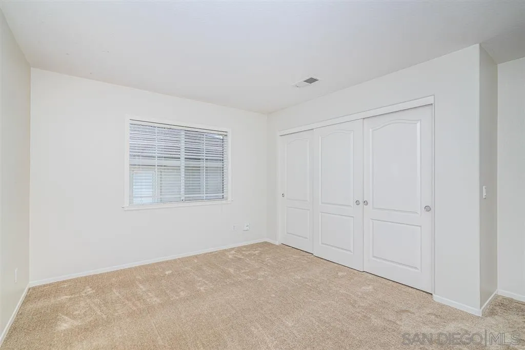 1088 Greenway Road Oceanside, CA 92057 - Photo 17 of 25 a view of an empty room with a window